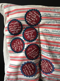 a pillow with a red, white and blue stripe on it