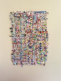 a piece of art made out of colorful strips of paper