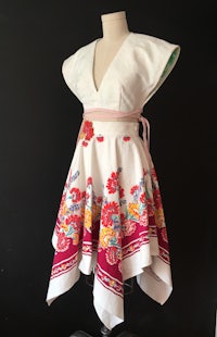 a mannequin dressed up in a floral apron